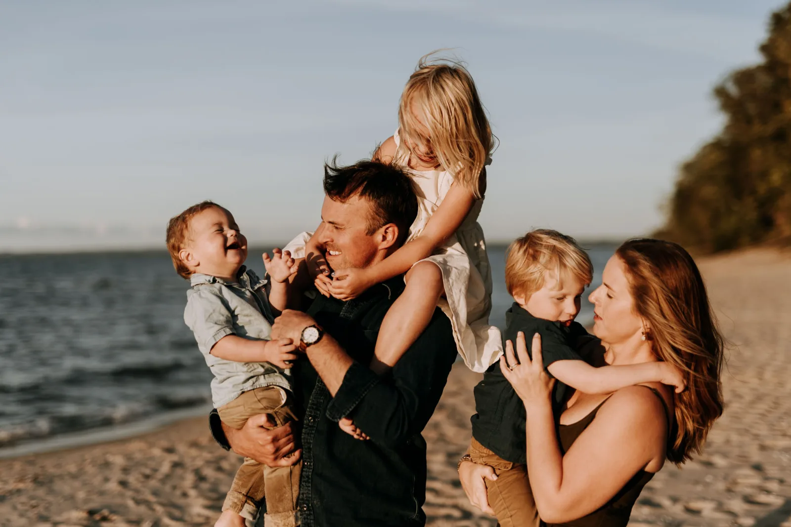 Johnson family laughing together near the lighthouse
