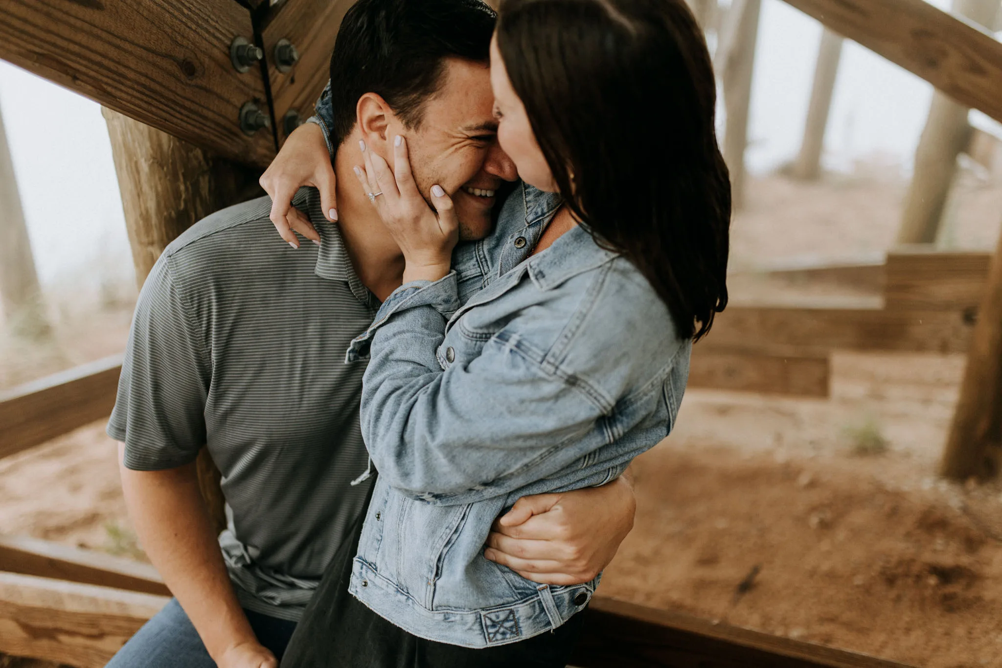 Couple embracing after a surprise proposal at Sleeping Bear Dunes