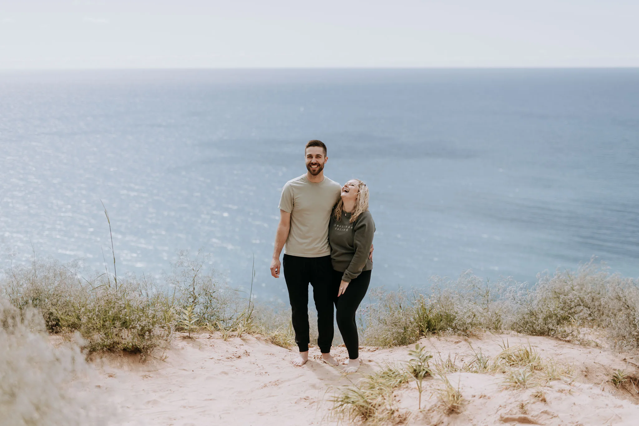 Couple at the Empire Bluffs overlook during golden hour, Northern Michigan