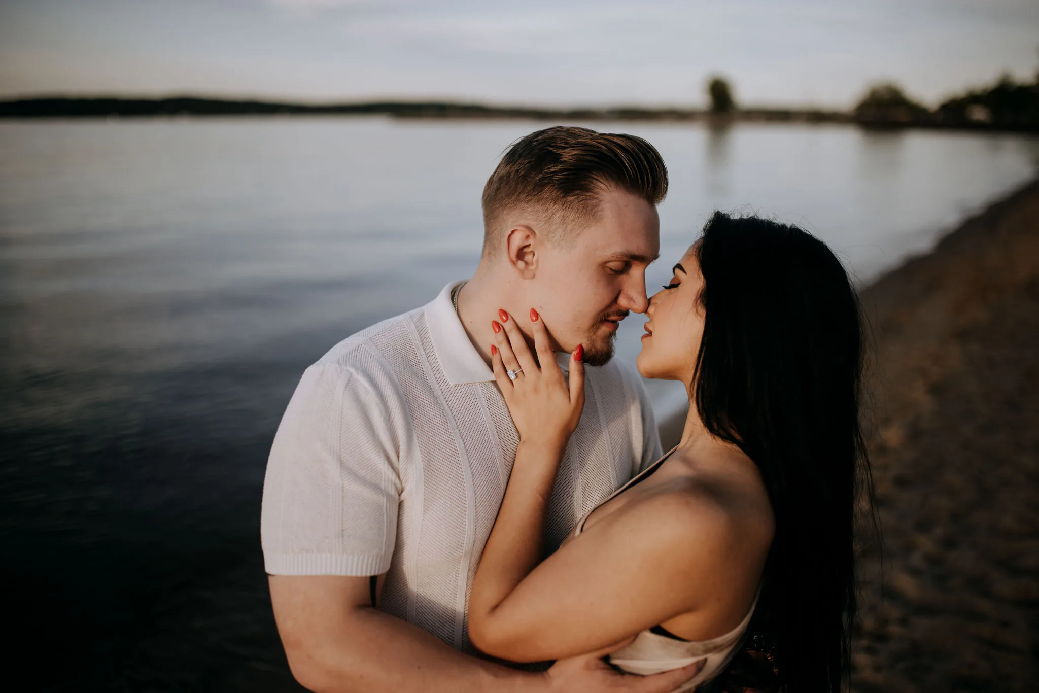 Proposal moment on a quiet Lake Michigan beach in Leelanau County