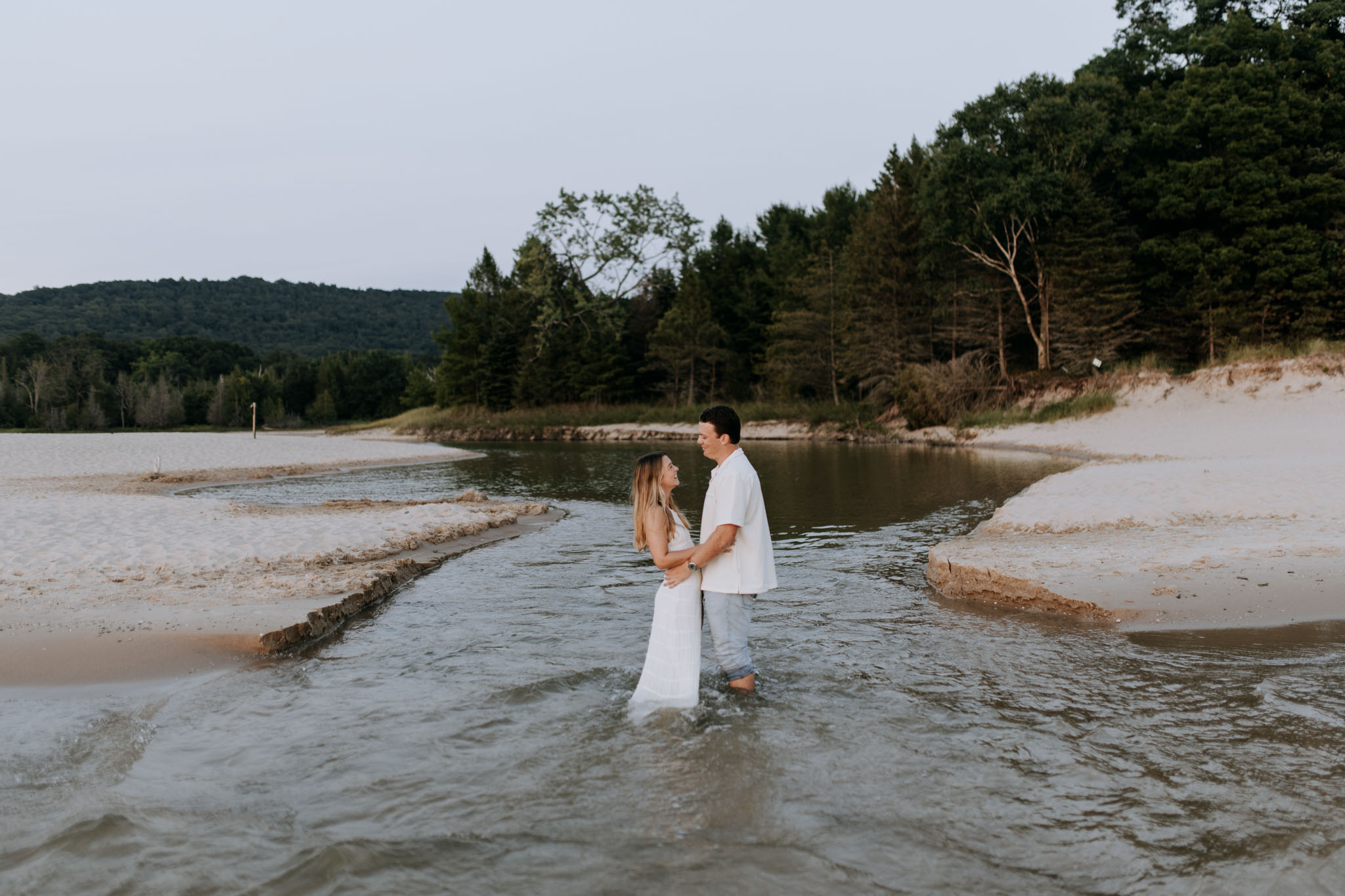 Couple walking together during a Northern Michigan engagement session
