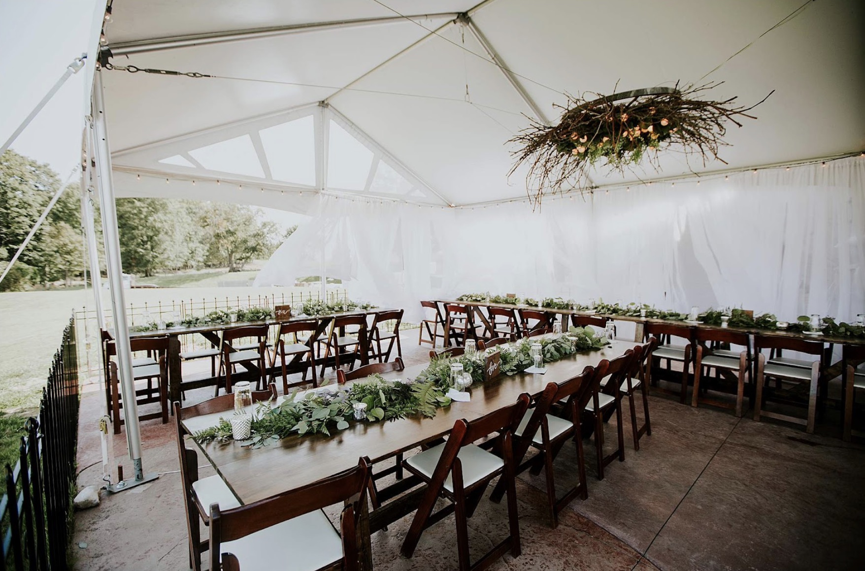 Aurora Cellars Terrace wedding reception tent with tables Leelanau County
