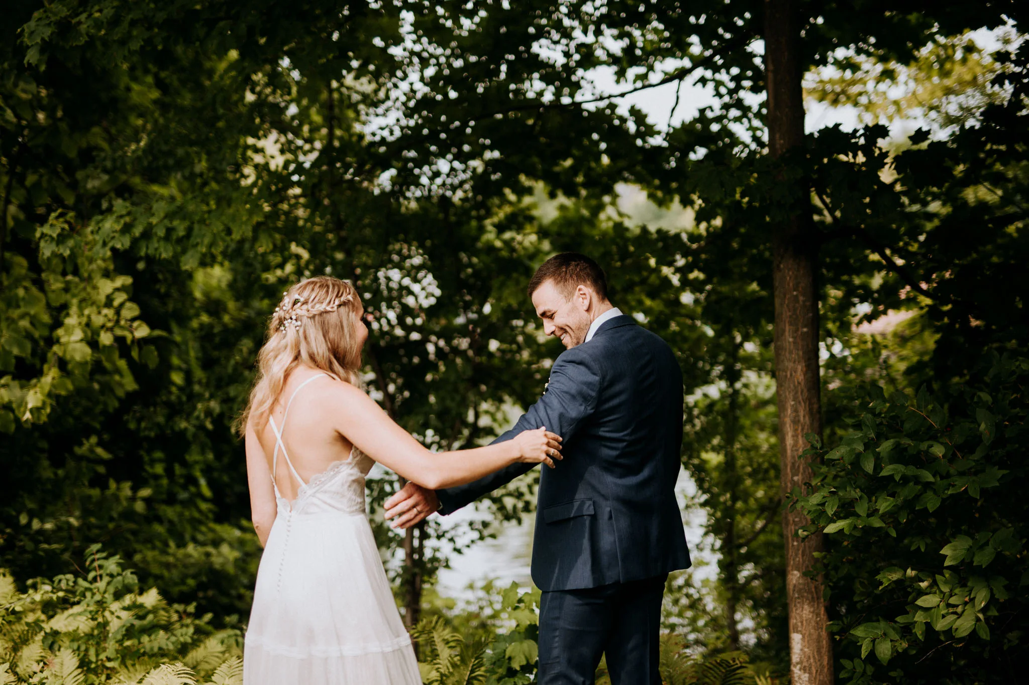 Bride and groom first kiss at the Old Art Building wedding in Leland Michigan