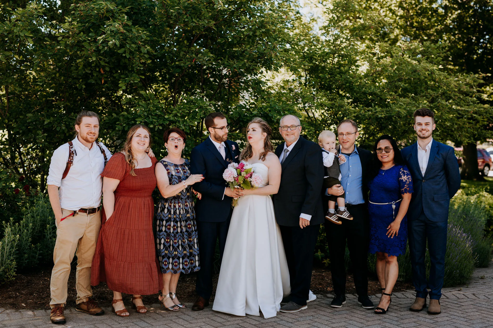 Bride walking down the aisle with her parents at Leland Michigan wedding