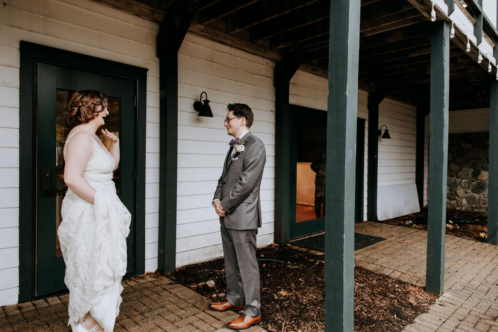 Wedding couple during first look at the Old Art Building in Leland Michigan