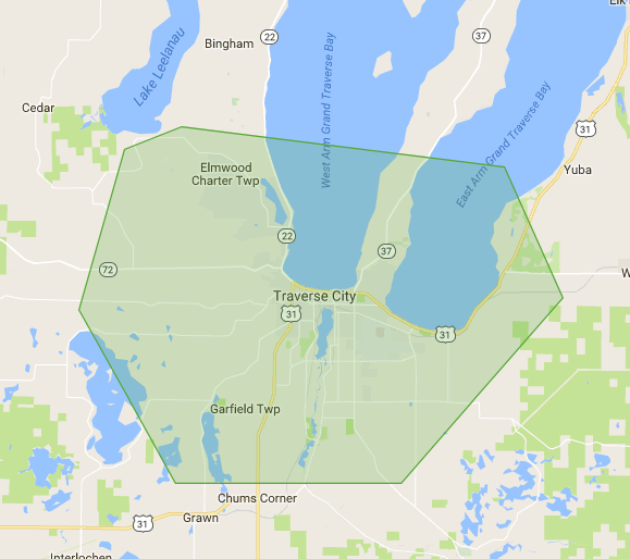 Map showing the travel area included in most Allen-Kent Photography sessions, centered on the Traverse City and Leelanau region of Northern Michigan