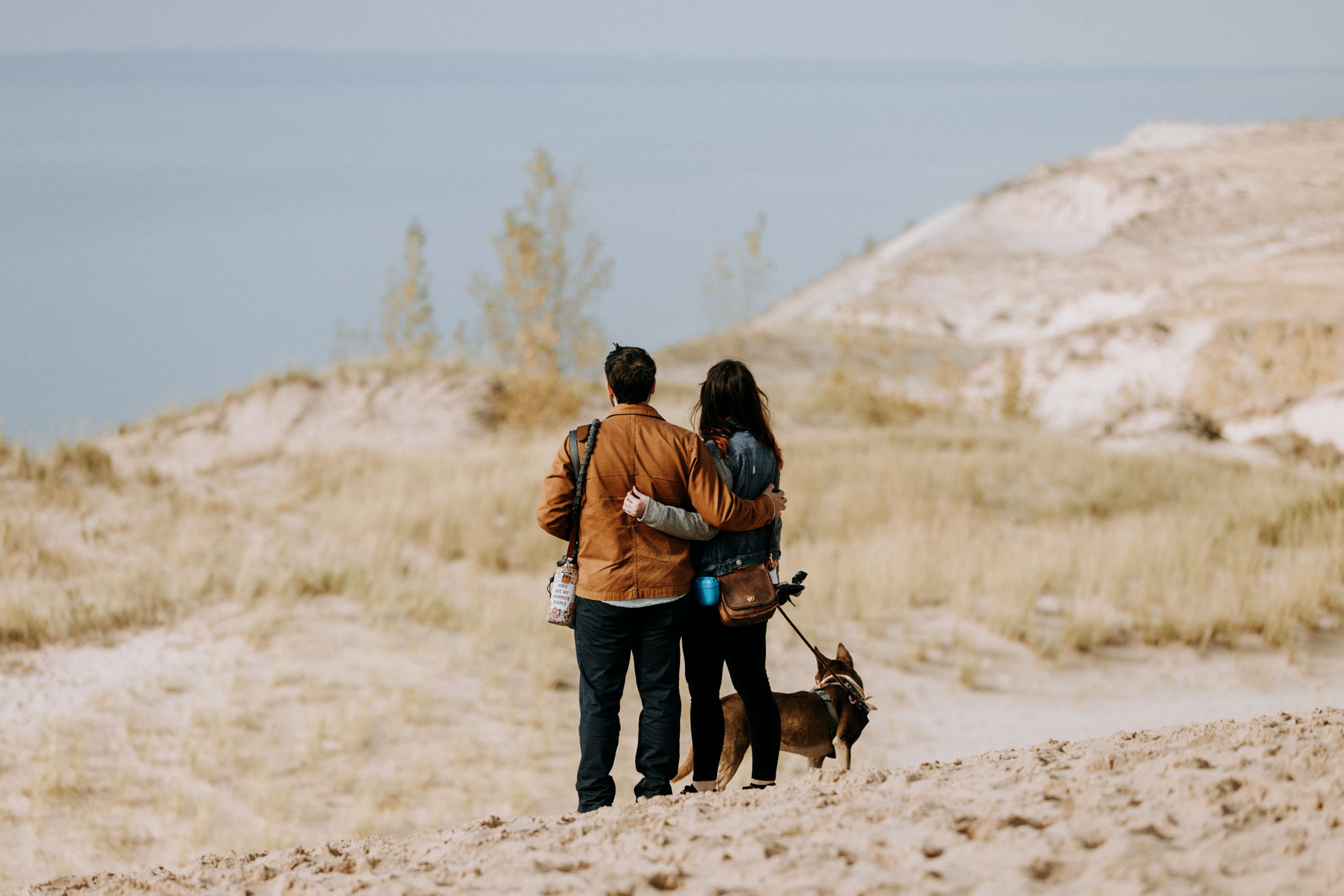 Engagement portrait in wooded stretch of Pierce Stocking Scenic Drive