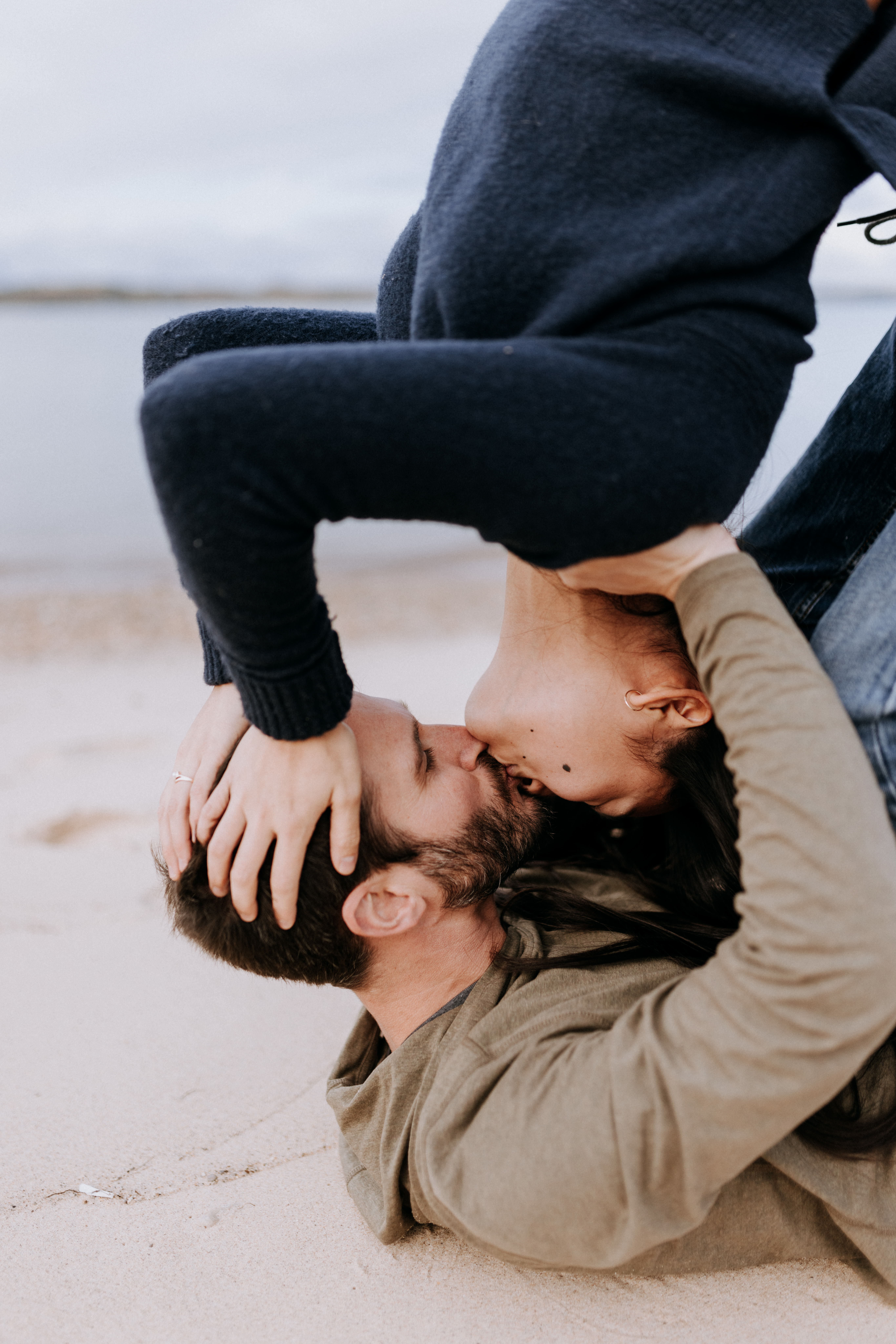 Vertical engagement portrait along Lake Michigan, Chelsea and Nick