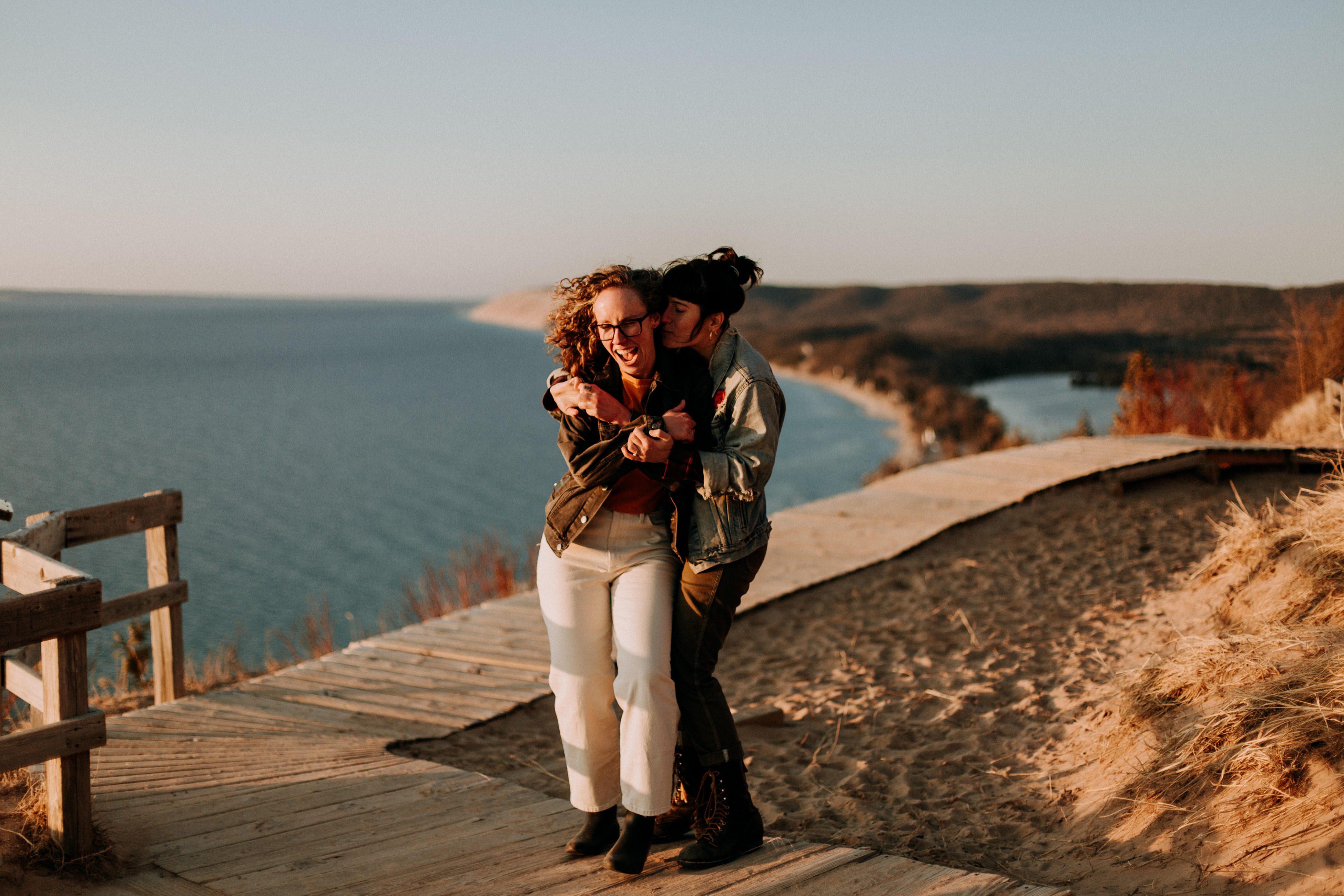 Candid laughing moment during Traverse City engagement photography, Jessica and Zoe
