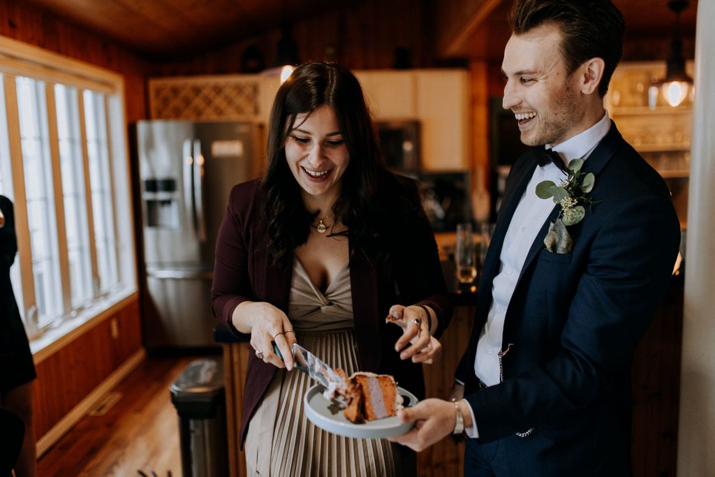 Elopement Couple Cutting a wedding cake