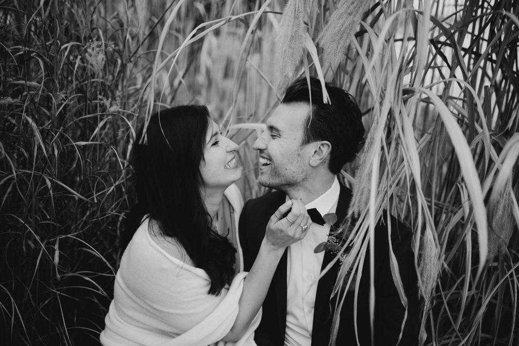 Elopement Couple Sitting in reeds