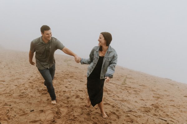 couple walking in the rain on pierce stocking scenic drive dunes overlook