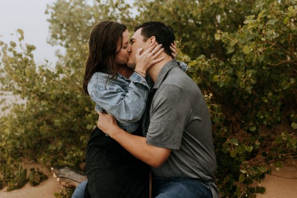 couple kissing in the rain on pierce stocking scenic drive dunes overlook
