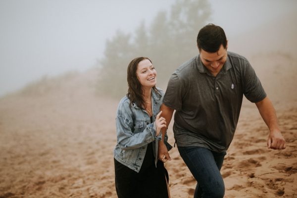 couple walking in the rain on pierce stocking scenic drive dunes overlook