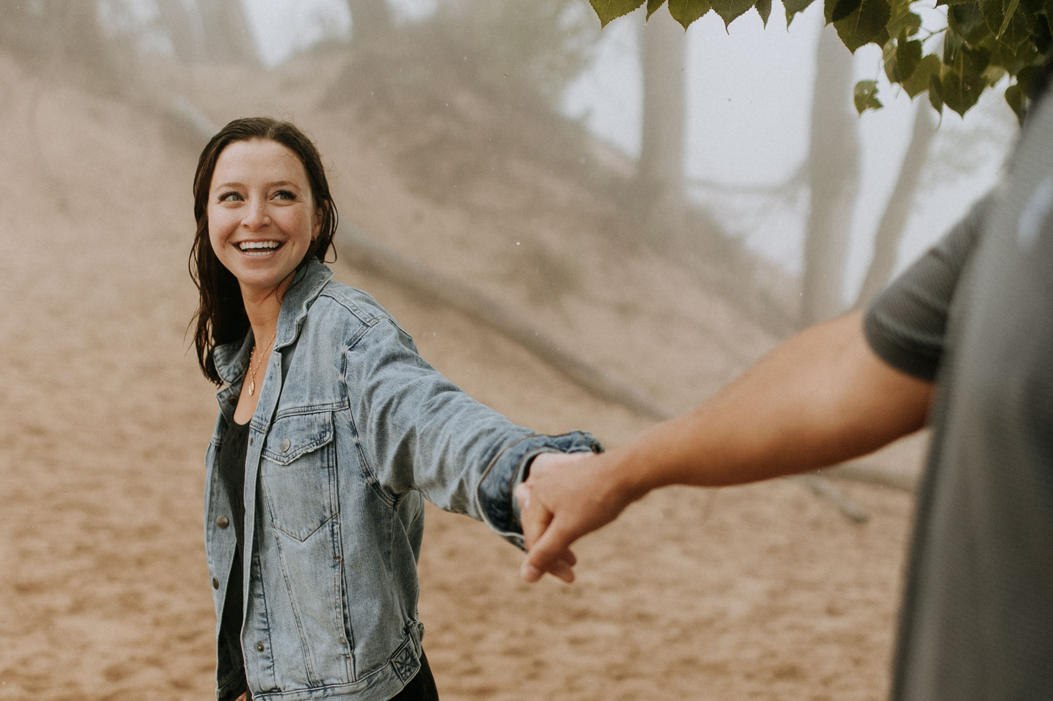 couple walking in the rain on pierce stocking scenic drive dunes overlook