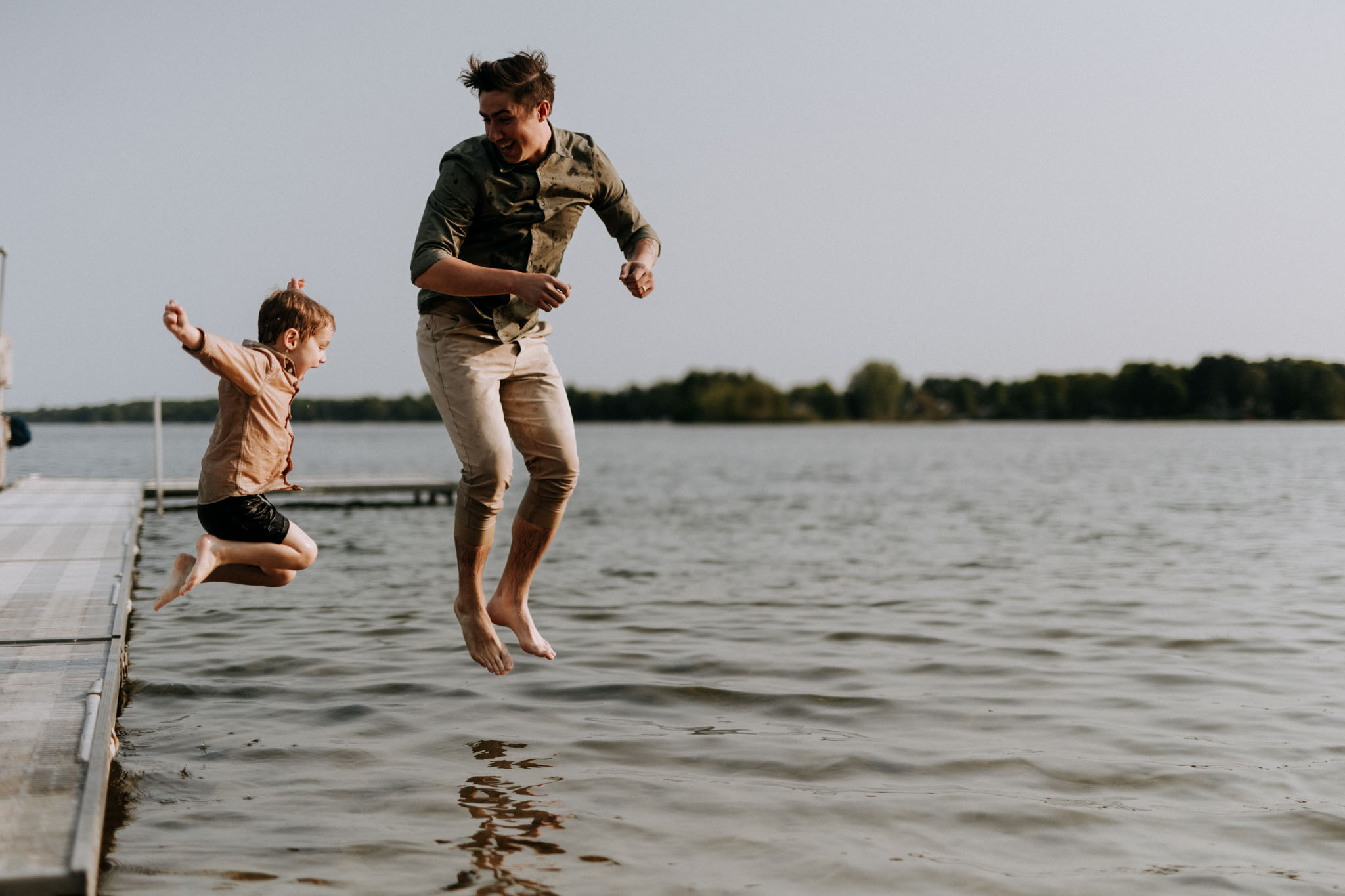 Swan kids playing in the water at a Traverse City beach, summer 2023