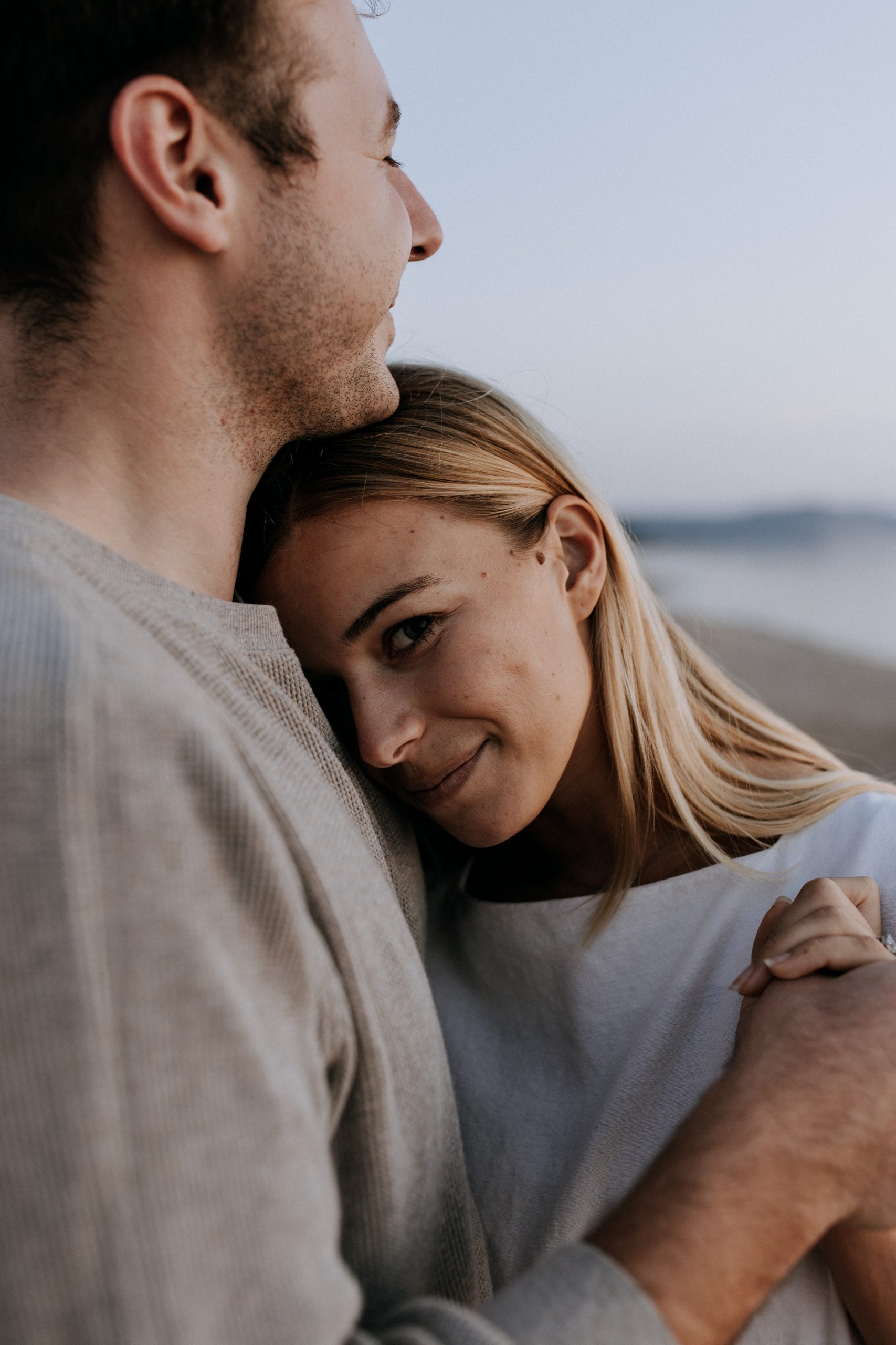 Couple during golden hour engagement session at Sleeping Bear Dunes