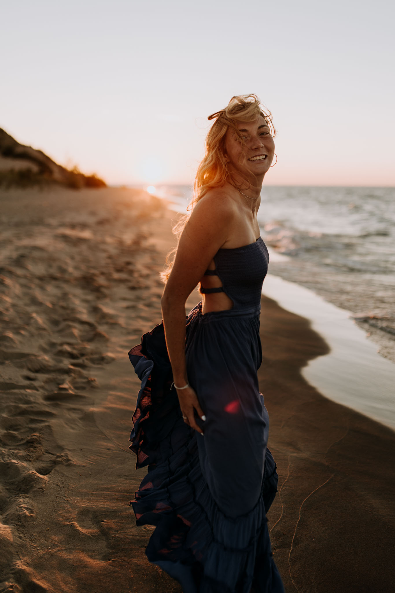 Couple silhouetted at blue hour on Lake Michigan