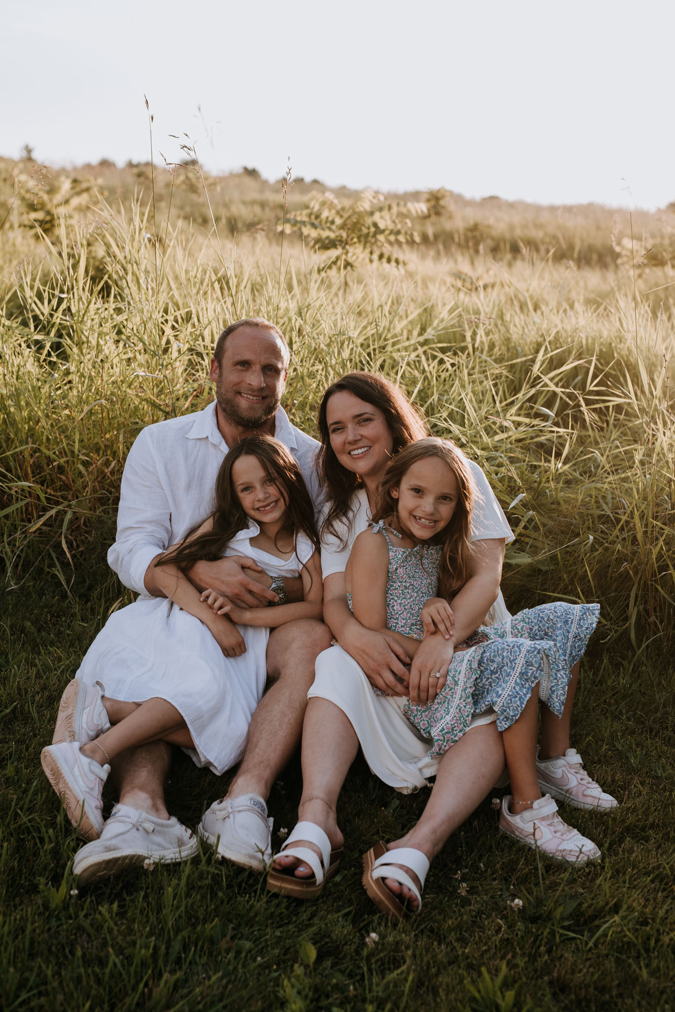 Roberts girls jumping on a Lake Michigan beach at sunset