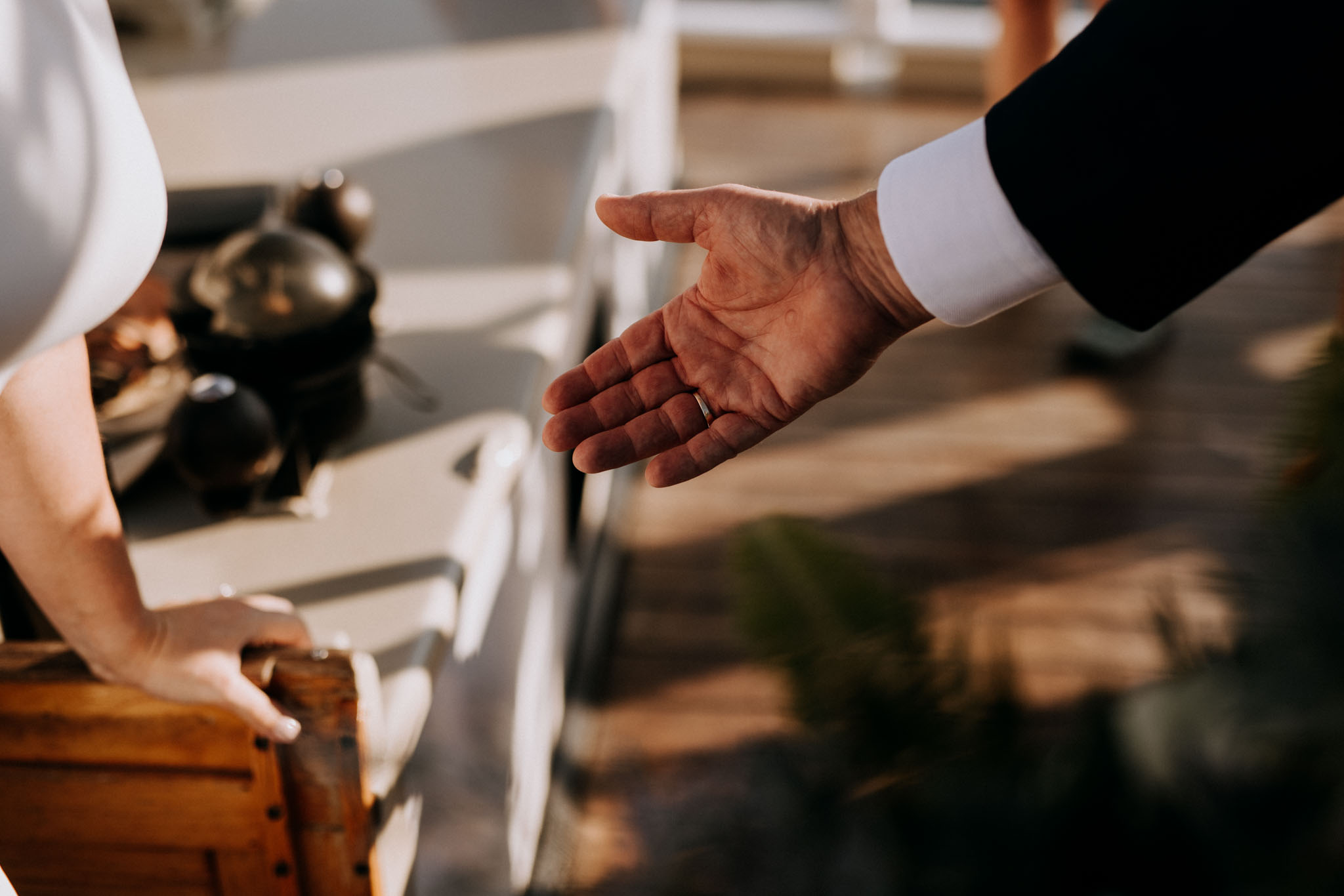 Maggie and Cam exchanging vows on the deck of the Tall Ship Manitou
